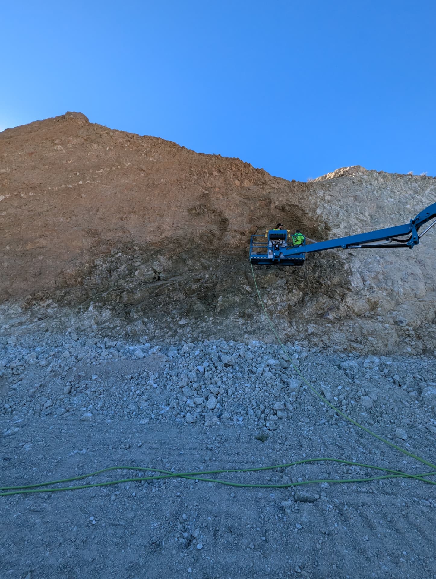 Crew applying face treatment on a cut slope