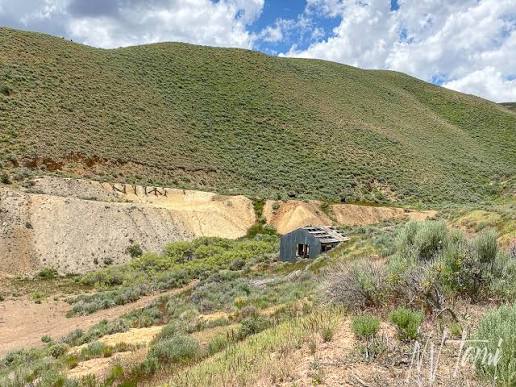 Regraded waste rock benches blending into native hillside